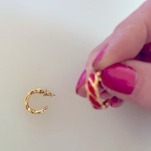 Gold tone red post half hoop earrings.